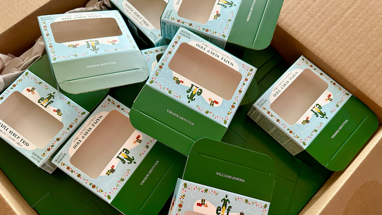 An assortment of maple syrup cardboard sample boxes.